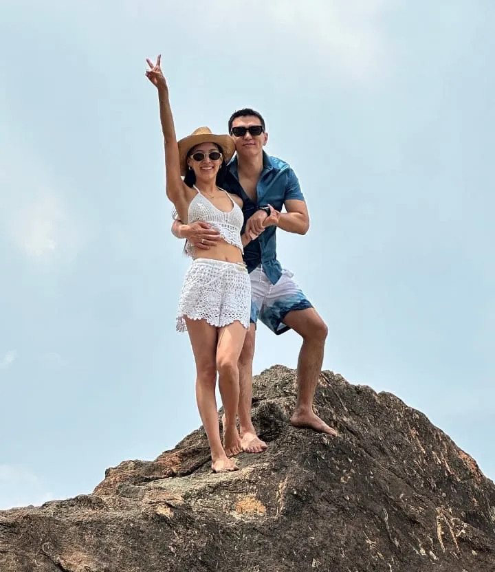 Couple standing on a rock enjoying scenic views during a Sri Lanka 7-day tour