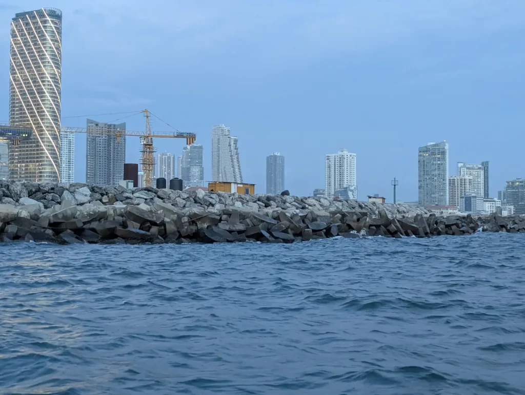 Colombo to Sigiriya: The Real Distance, the Real Hours, and the Stops Worth Making 1 The Colombo city skyline and Port City towers seen across the water from a boat