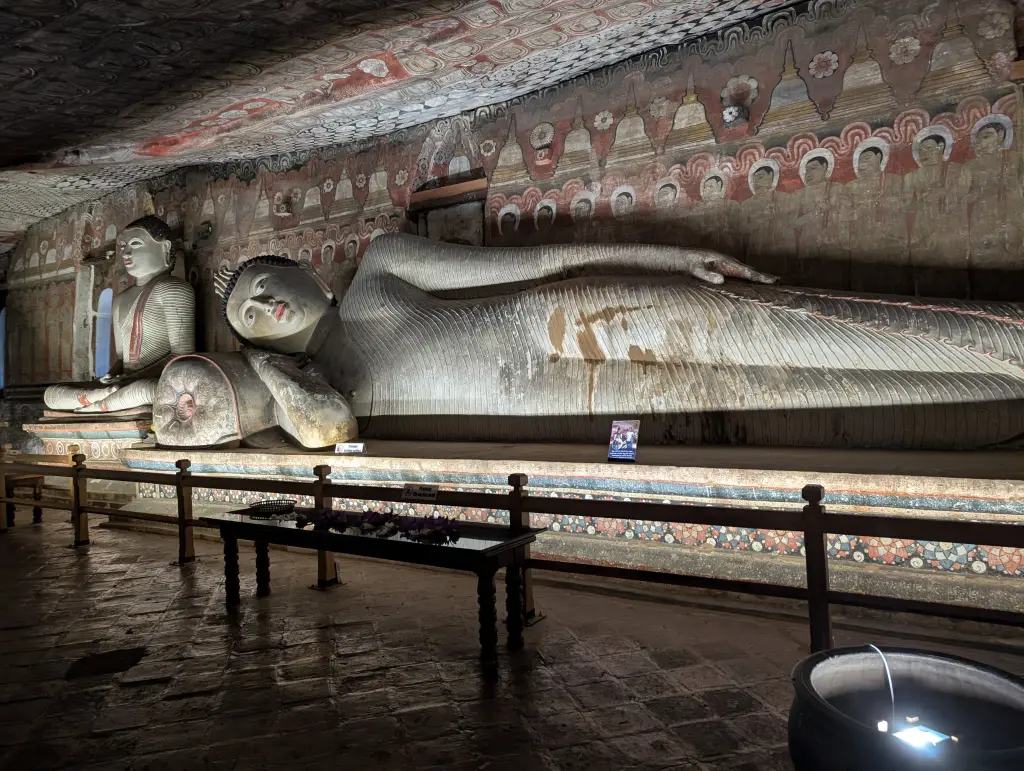 Colombo to Sigiriya: The Real Distance, the Real Hours, and the Stops Worth Making 2 Reclining Buddha carved from rock at Dambulla Cave Temple, Sri Lanka
