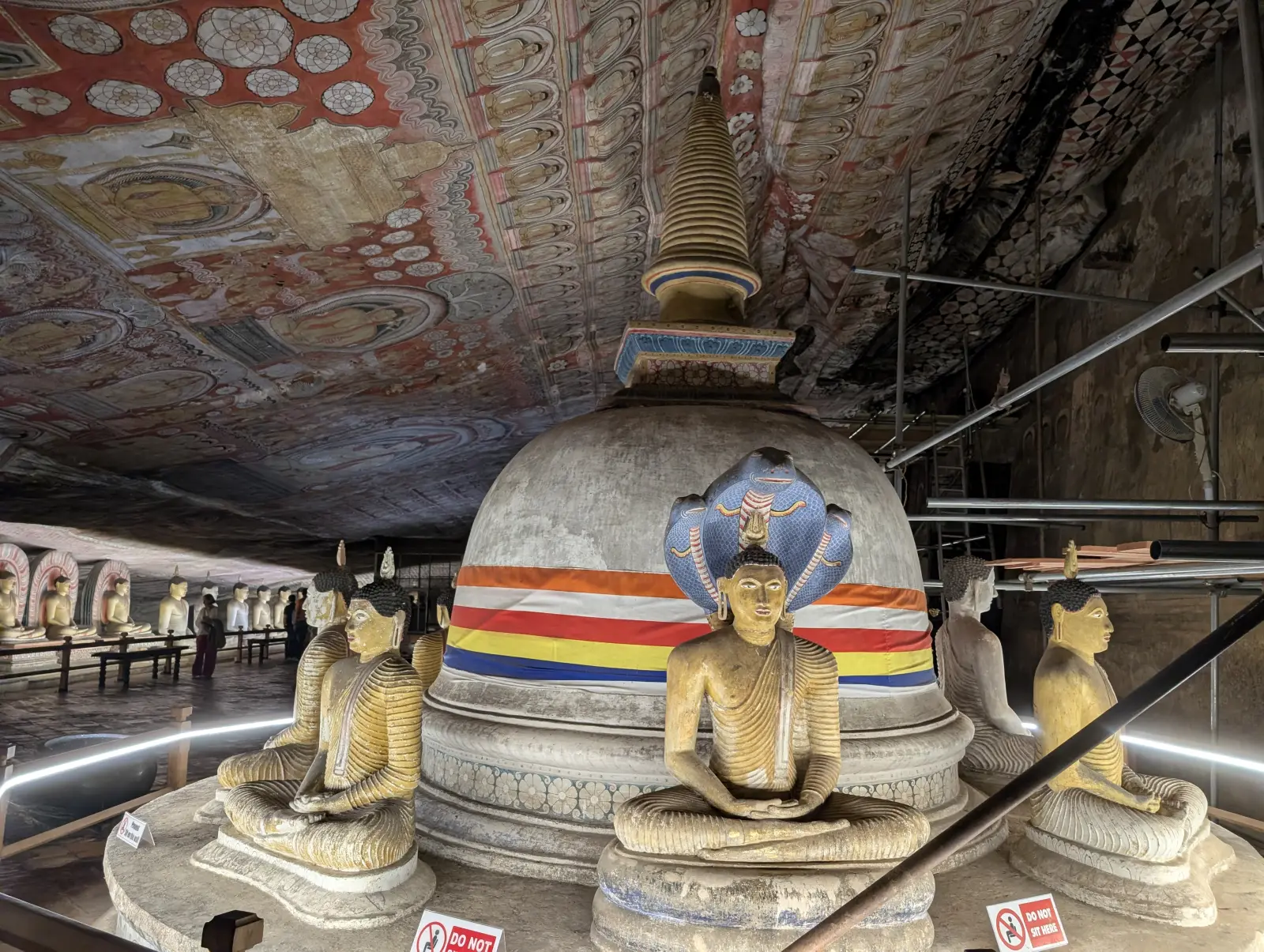 Sigiriya or Pidurangala: Which Rock to Climb, and How to Do Both in One Day 1 Stupa and seated Buddha statues inside Dambulla Cave Temple, Sri Lanka